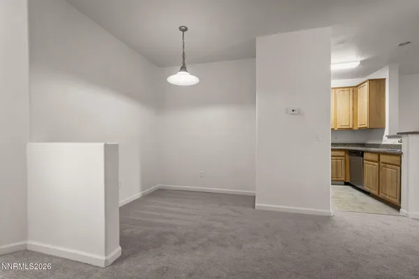 a view of a kitchen with a sink and dishwasher cabinets