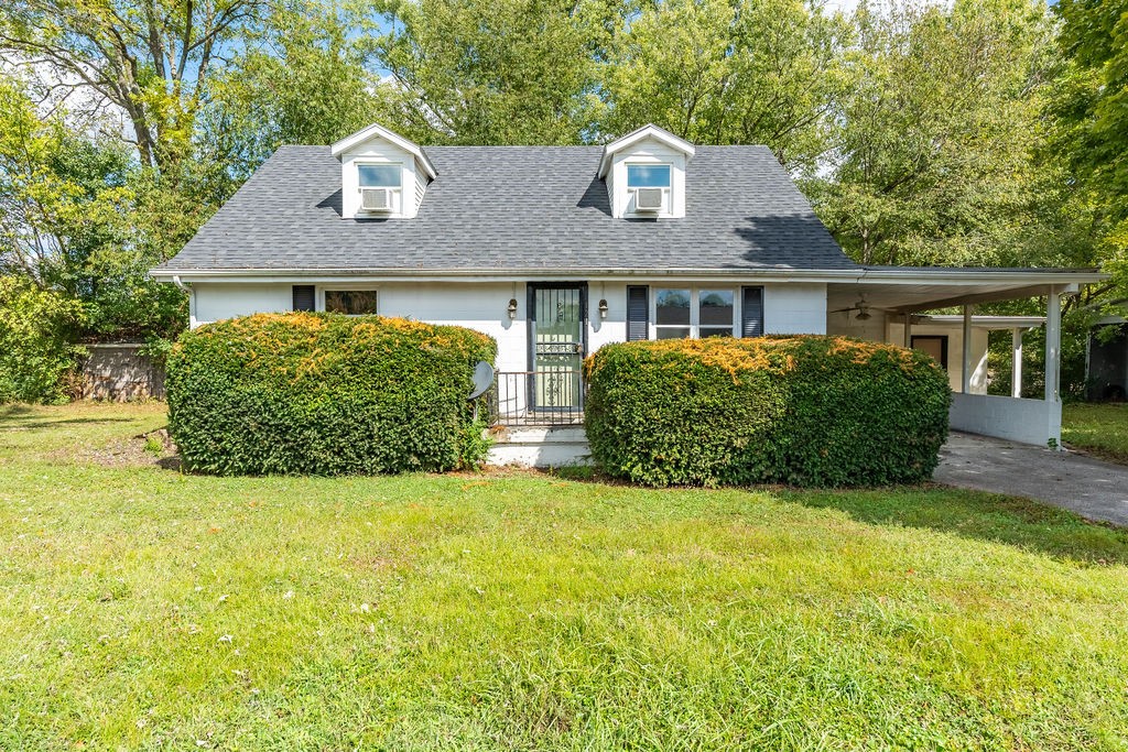 front view of a house with a yard
