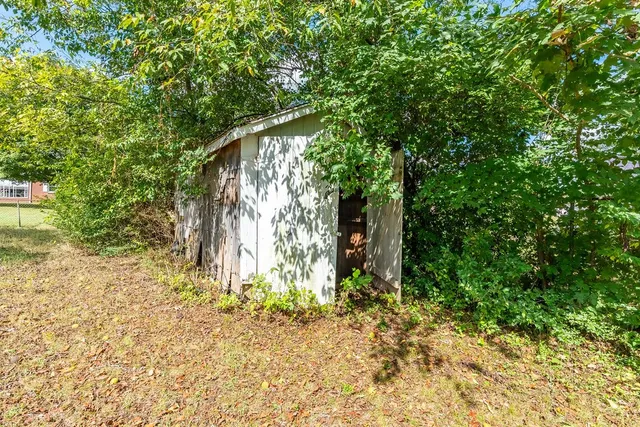 a view of a backyard of a house