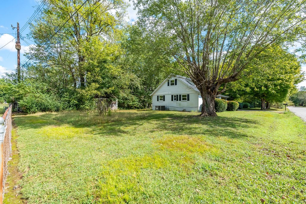 121 Highland School Road Hopkinsville, KY 42240 - Photo 27 of 31 a view of a garden with large trees