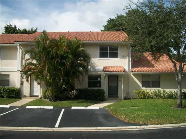 6421 Boca Circle Boca Raton, FL 33433 - Photo 1 of 8 a front view of a house with a yard and garage