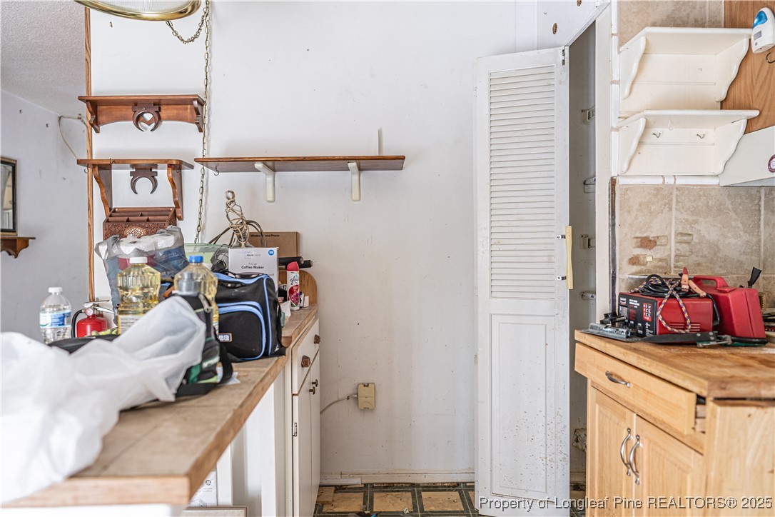 8212 Main Street West End, NC 27376 - Photo 18 of 36 a bedroom with a bed and a couch