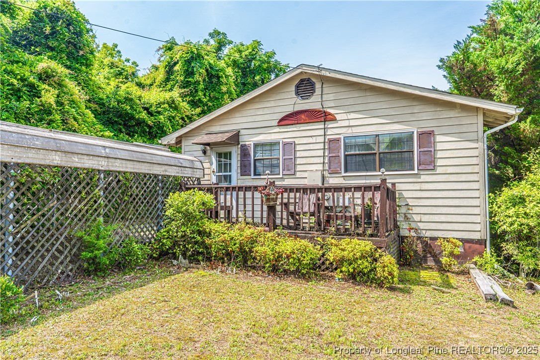 8212 Main Street West End, NC 27376 - Photo 2 of 36 a front view of a house with a yard