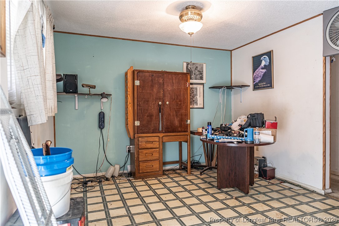 8212 Main Street West End, NC 27376 - Photo 22 of 36 a room with furniture a rug and a table
