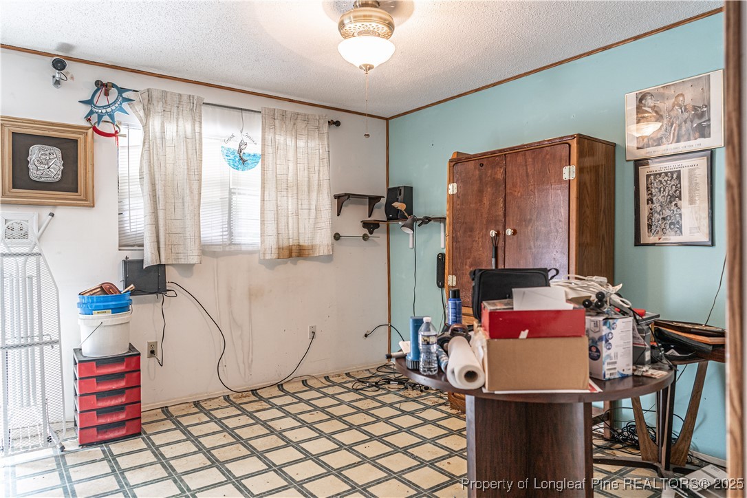 8212 Main Street West End, NC 27376 - Photo 23 of 36 a bedroom with furniture and a window