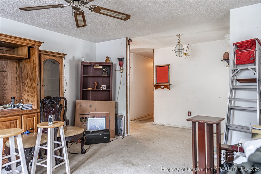 8212 Main Street West End, NC 27376 - Photo 35 of 36 a room with furniture a ceiling fan and a window
