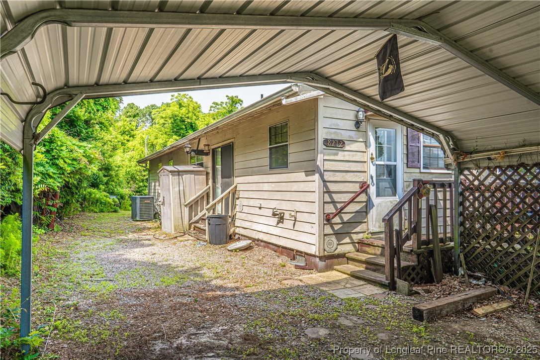 8212 Main Street West End, NC 27376 - Photo 5 of 36 a view of a house with a yard and sitting area