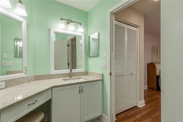 a bathroom with a double vanity sink and a mirror
