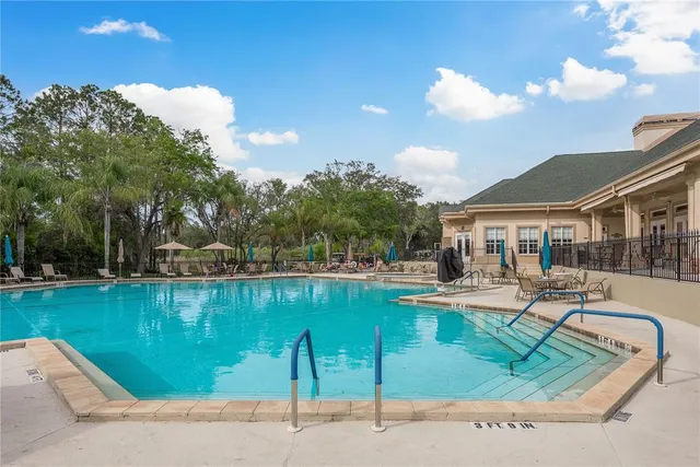 a house view with swimming pool and outdoor space