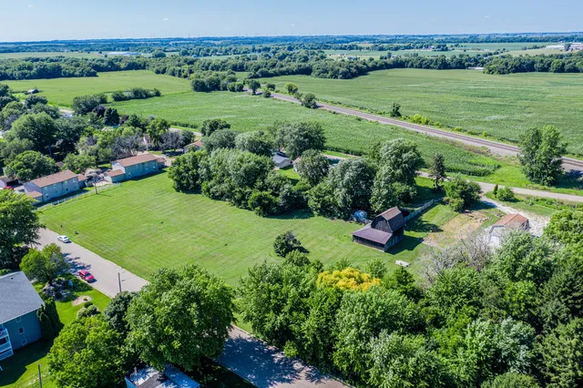 a view of a garden with a building in the background