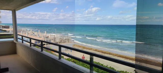 a view of an outdoor kitchen with a large window