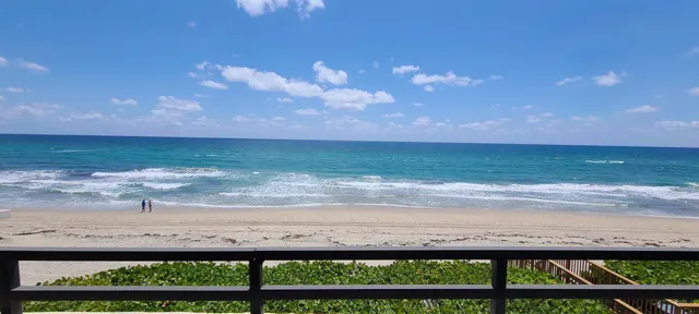 a view of a kitchen with a sink and microwave