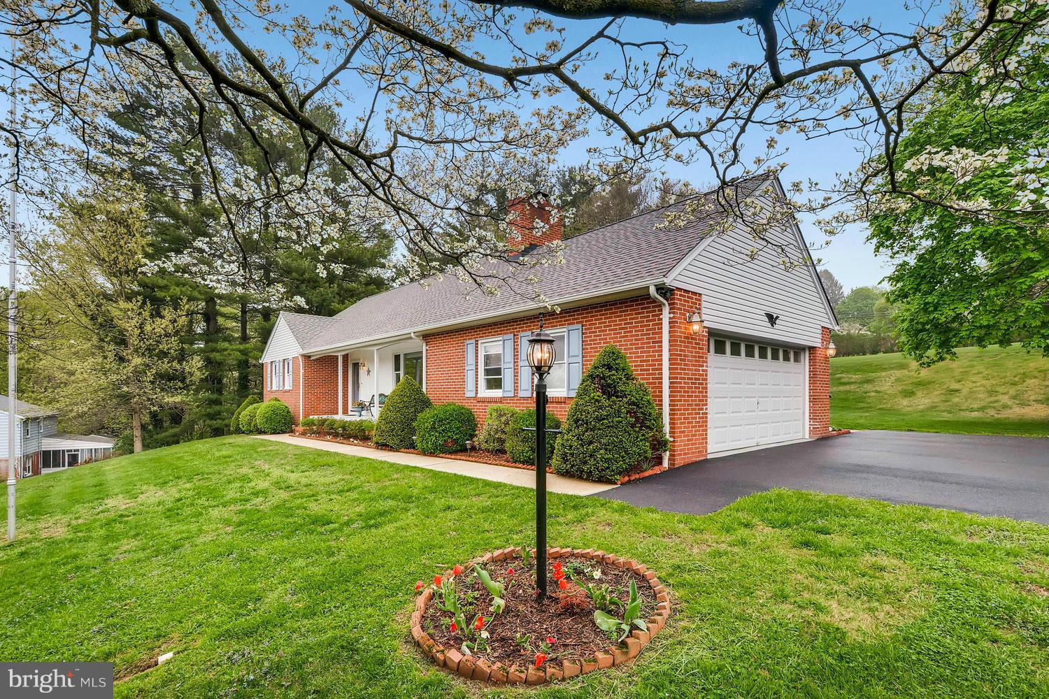 2705 Lawson Road Fallston, MD 21047 - Photo 2 of 30 a front view of a house with a yard and garage
