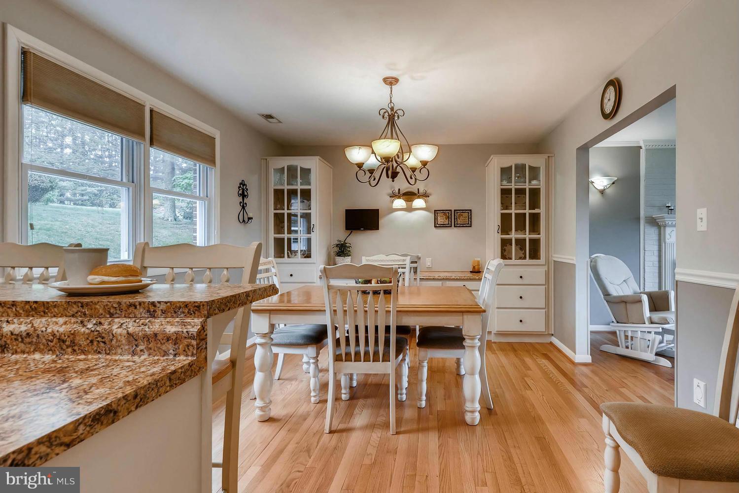 2705 Lawson Road Fallston, MD 21047 - Photo 13 of 30 a view of a dining room with furniture a chandelier and wooden floor