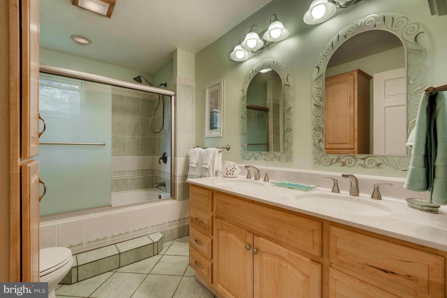 2705 Lawson Road Fallston, MD 21047 - Photo 16 of 30 a bathroom with a double vanity sink mirror and shower