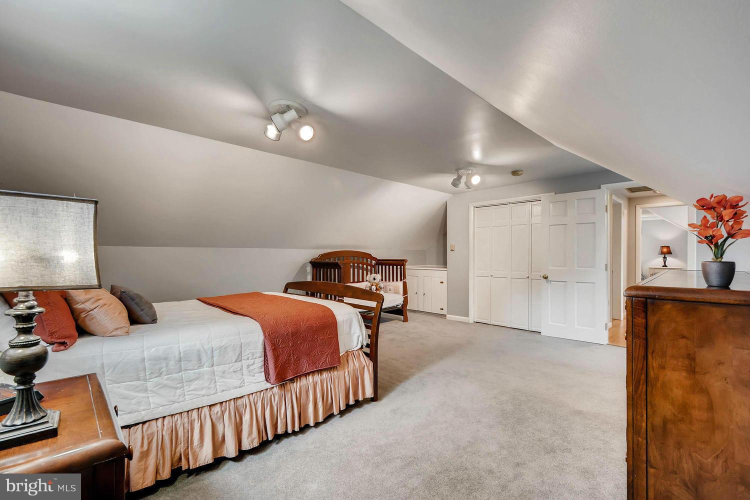 2705 Lawson Road Fallston, MD 21047 - Photo 19 of 30 a bedroom with bed and a chandelier
