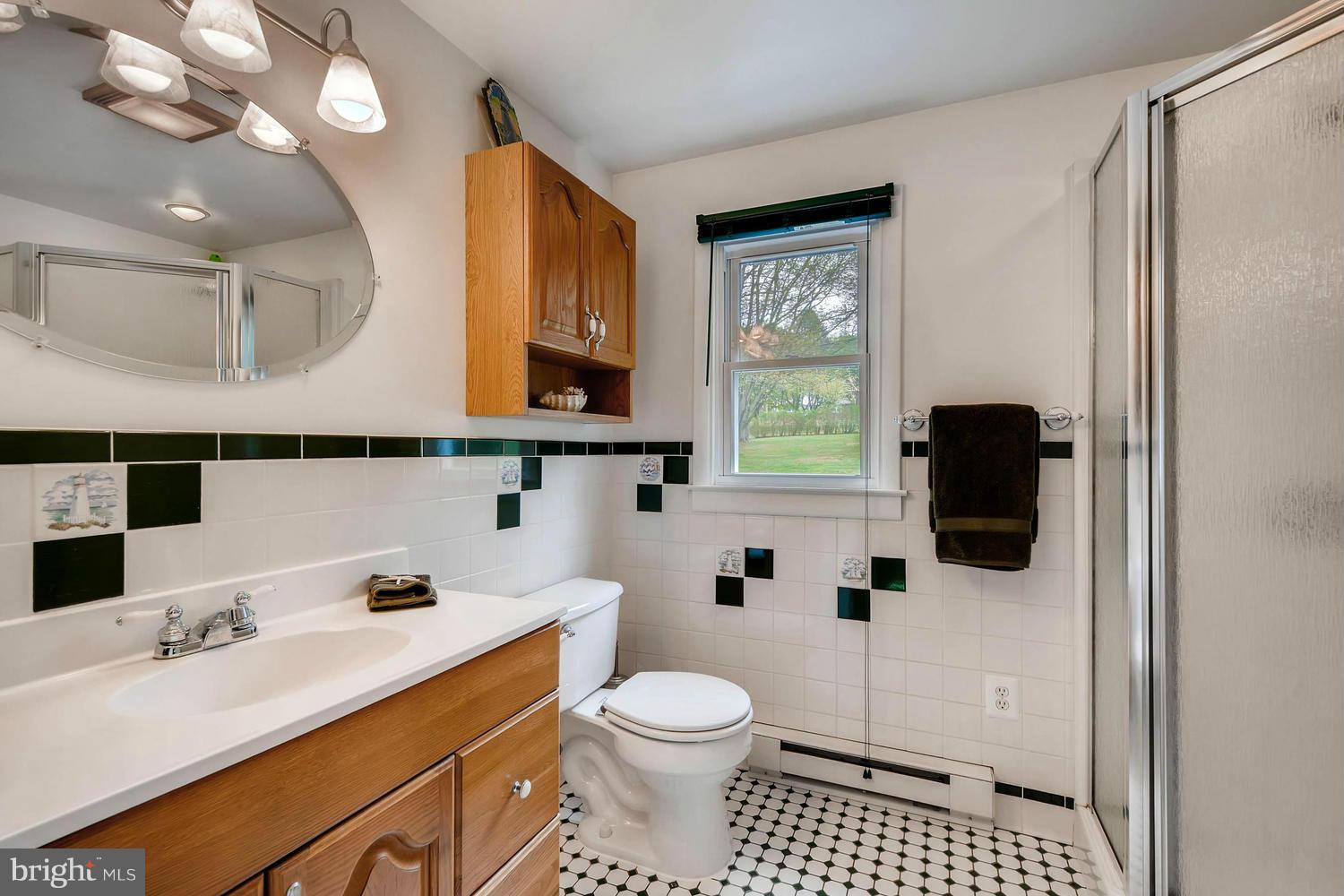 2705 Lawson Road Fallston, MD 21047 - Photo 20 of 30 a bathroom with a sink a toilet and shower curtain