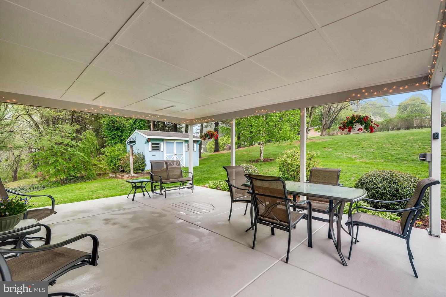 2705 Lawson Road Fallston, MD 21047 - Photo 27 of 30 a view of a patio with a table chairs and a yard