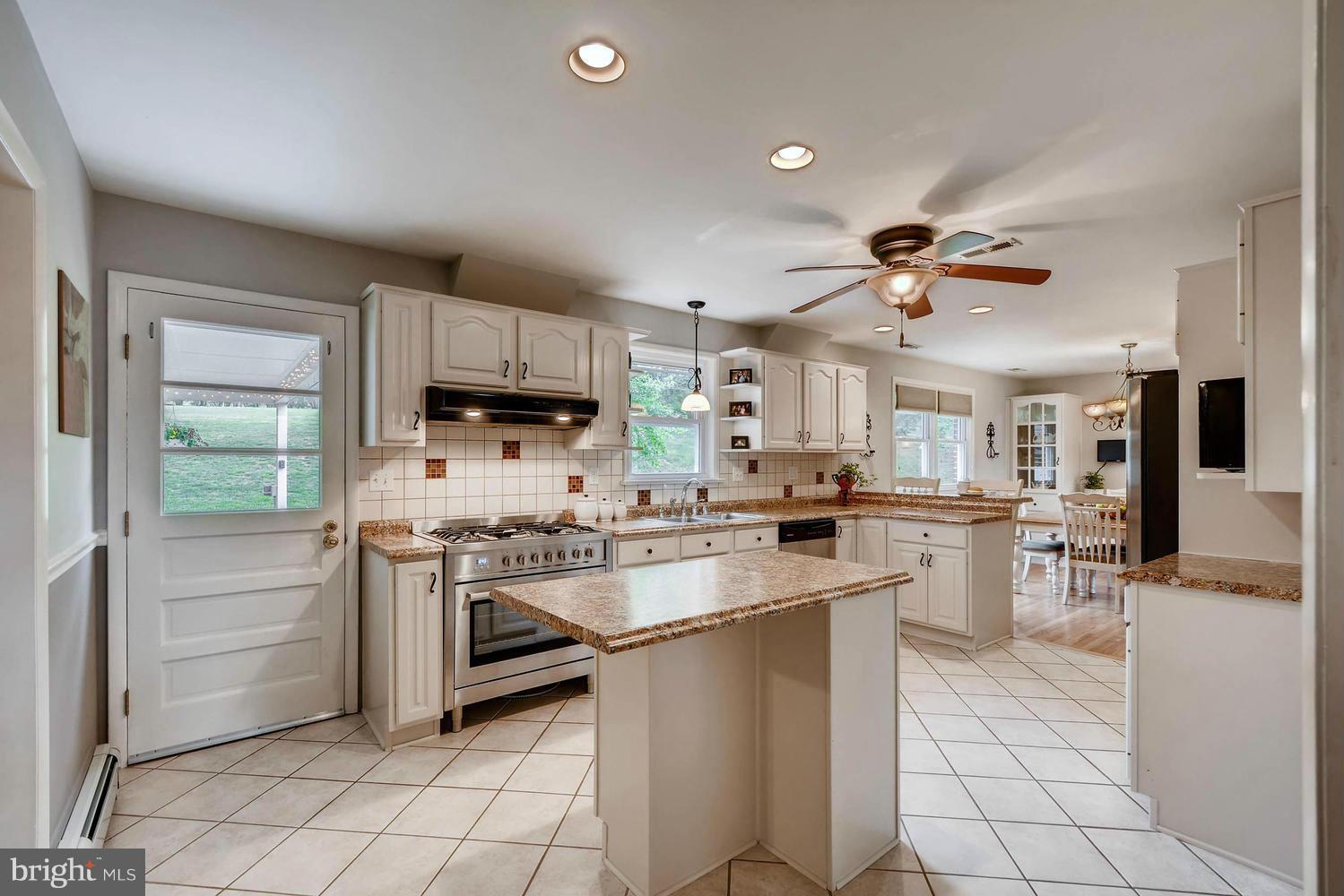2705 Lawson Road Fallston, MD 21047 - Photo 10 of 30 a kitchen with cabinets and chairs
