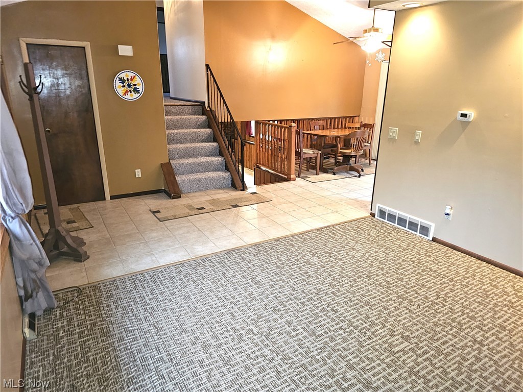 3089 Batdorf Road Wooster, OH 44691 - Photo 6 of 21 This is the entry of the home. The picture was taken from the formal dining room. The front door is on the far left. In the middle of the picture you can see the stairs going up as well as the stairs going down to the Family Room. A little further to the right is the dining nook and the Kitchen is right around the corner to the right.