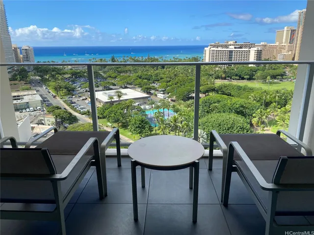 a view of a chairs and table in a patio