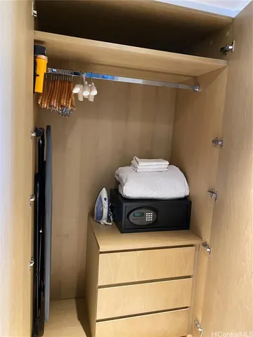 a bathroom with a toilet and a mirror