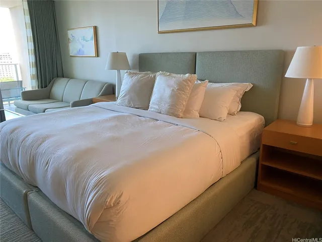 a bedroom with bed and window