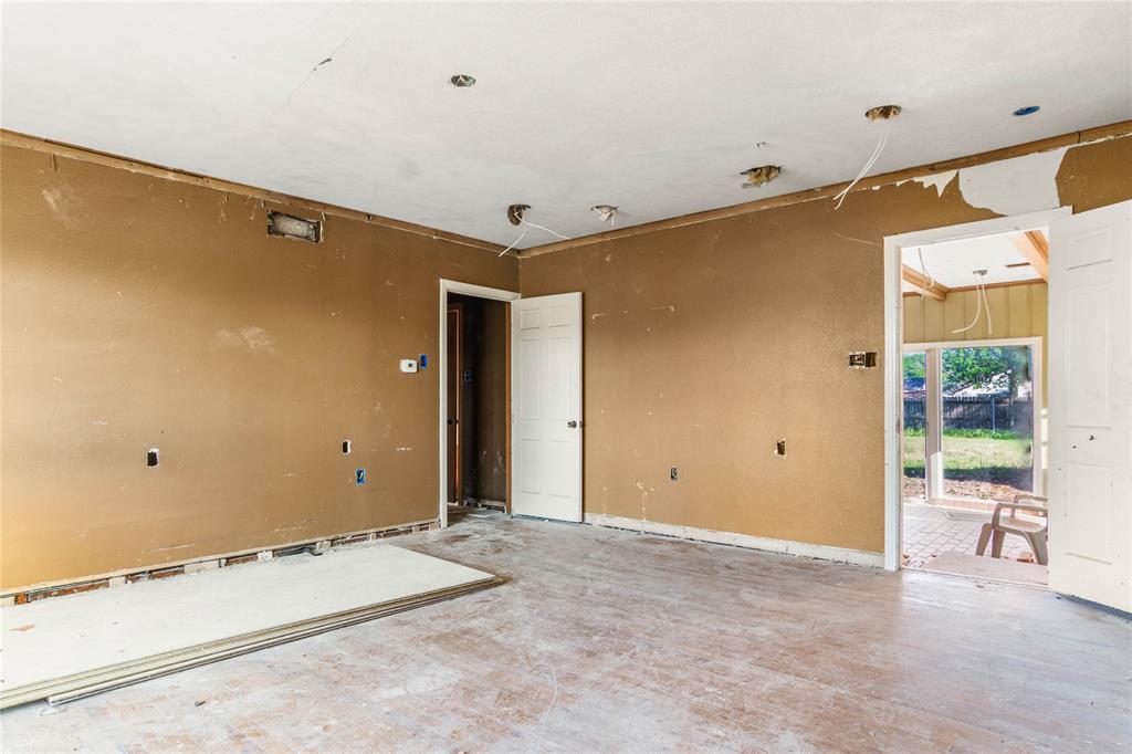 2928 Pine Avenue Waco, TX 76708 - Photo 11 of 24 a view of a livingroom with wooden floor and a bathroom