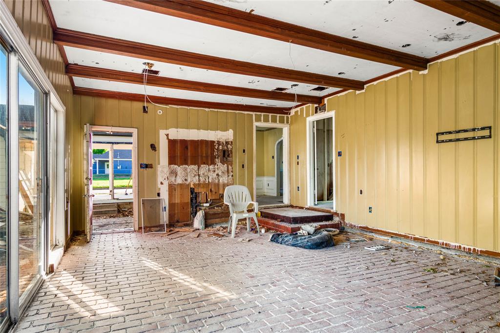 2928 Pine Avenue Waco, TX 76708 - Photo 14 of 24 a room with a chair and the view of living room