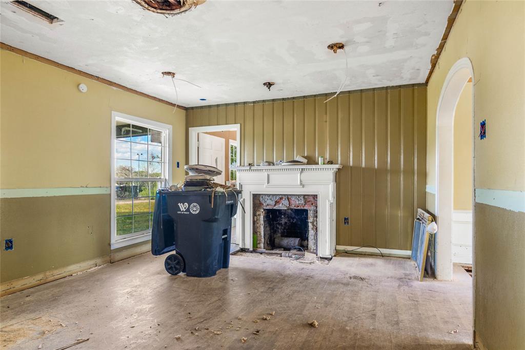 2928 Pine Avenue Waco, TX 76708 - Photo 4 of 24 a living room with furniture and a fireplace