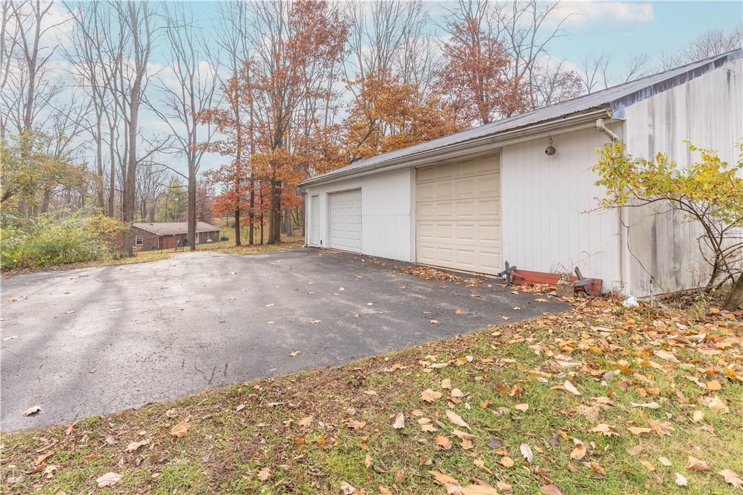 18333 Lefevre Number 2 Road Sidney, OH 45365 - Photo 18 of 25 This spacious garage offers ample parking and storage with convenient access.