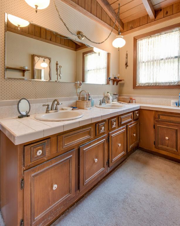 9794 Missionary Ridge Road Bon Aqua, TN 37025 - Photo 11 of 30 a spacious bathroom with a granite countertop double vanity and a mirror