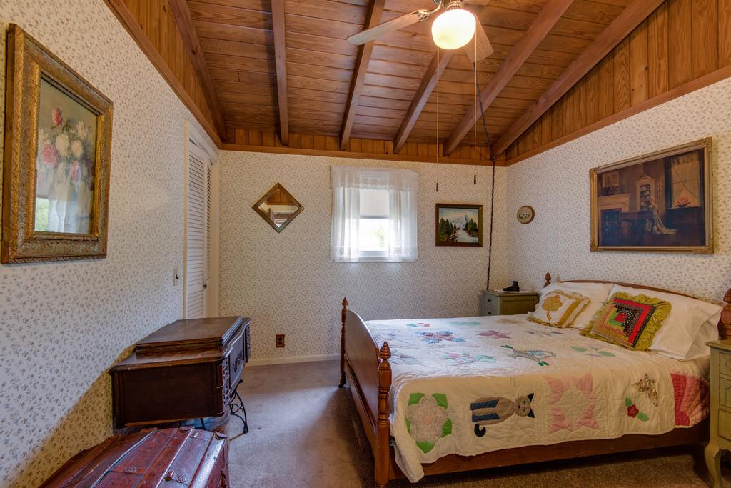 9794 Missionary Ridge Road Bon Aqua, TN 37025 - Photo 12 of 30 a bedroom with a bed and wooden floor