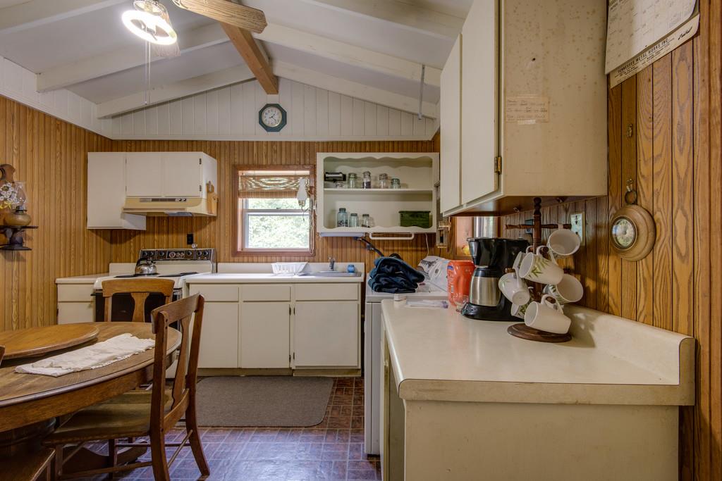 9794 Missionary Ridge Road Bon Aqua, TN 37025 - Photo 19 of 30 a kitchen with a sink and a refrigerator