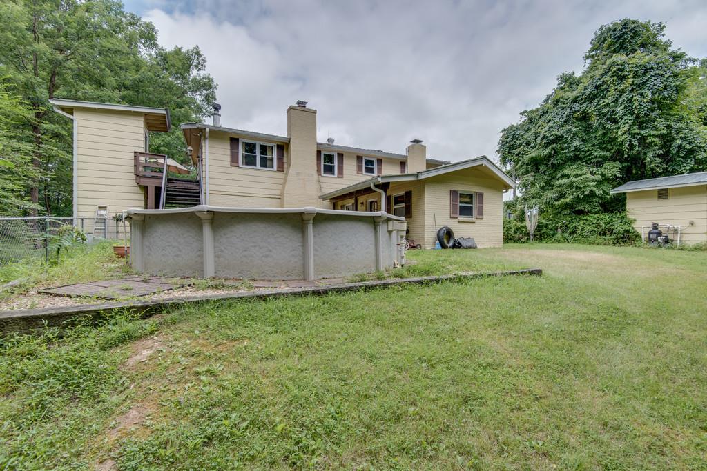 9794 Missionary Ridge Road Bon Aqua, TN 37025 - Photo 20 of 30 a front view of a house with a garden