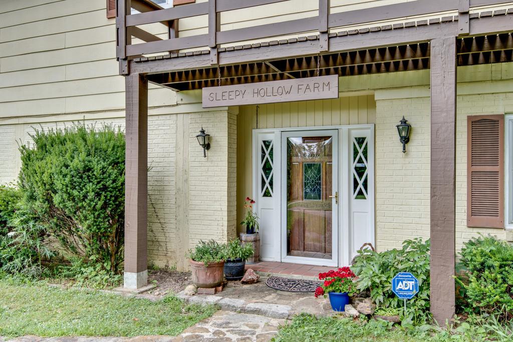 9794 Missionary Ridge Road Bon Aqua, TN 37025 - Photo 3 of 30 a front view of a building with an outdoor space