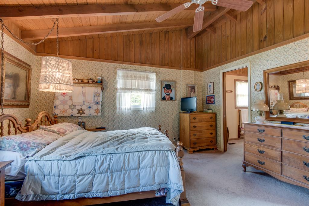 9794 Missionary Ridge Road Bon Aqua, TN 37025 - Photo 9 of 30 a bedroom with a bed and dresser