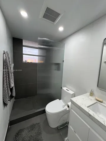 a bathroom with a sink and mirror