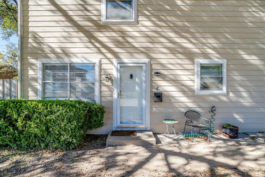 1900 Sutter Street, Unit C Fort Worth, TX 76107 - Photo 2 of 33 a backyard of a house with potted plants