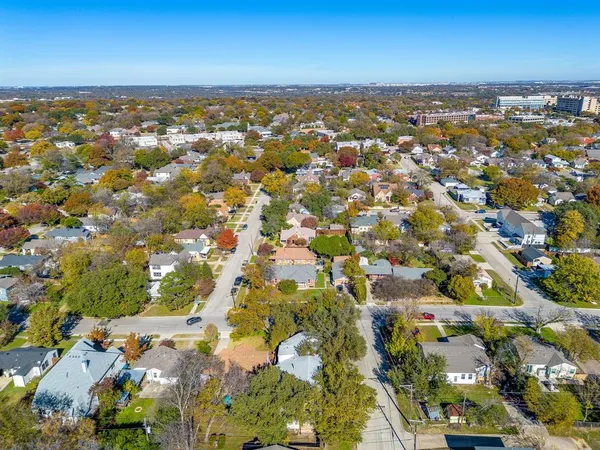 an aerial view of a city with lots of residential buildings