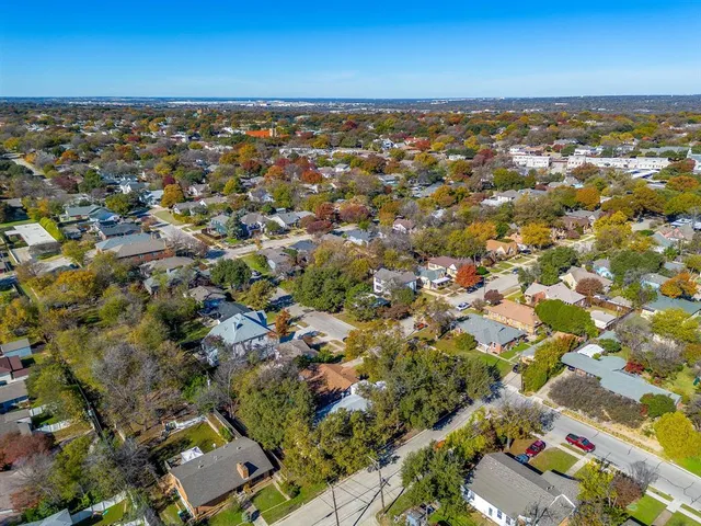 an aerial view of a city with lots of residential buildings