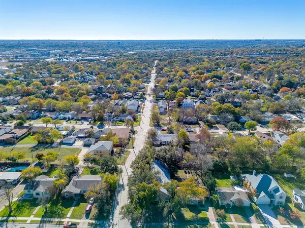 an aerial view of a city with lots of residential buildings