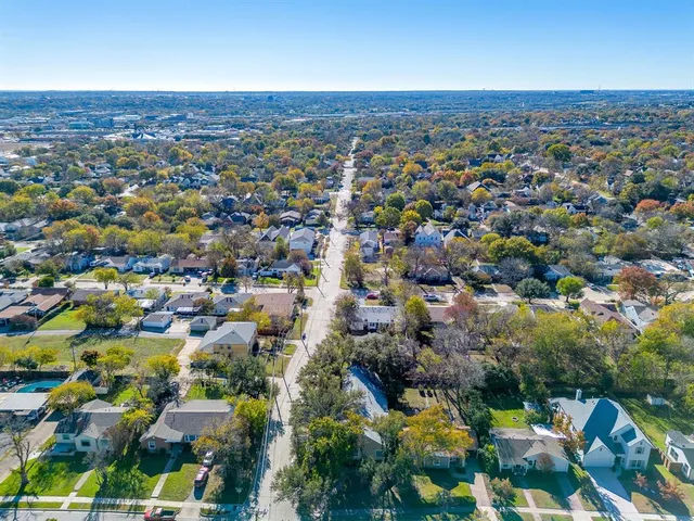 an aerial view of a city with lots of residential buildings