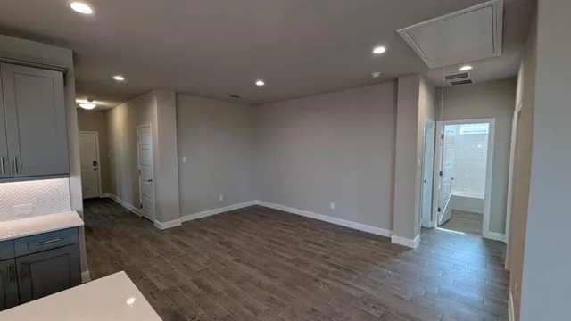 a front view of a house with yard and garage