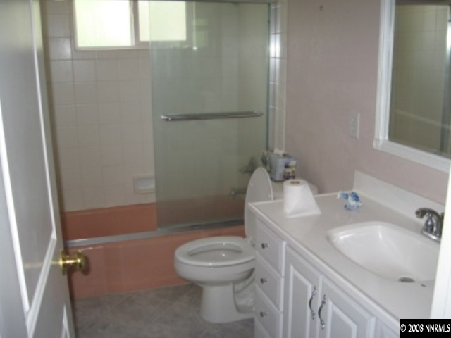 875 Lahontan Way Reno, NV 89509 - Photo 3 of 5 a bathroom with a sink a toilet and shower