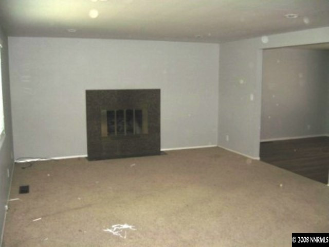 875 Lahontan Way Reno, NV 89509 - Photo 4 of 5 a view of an empty room with a fireplace
