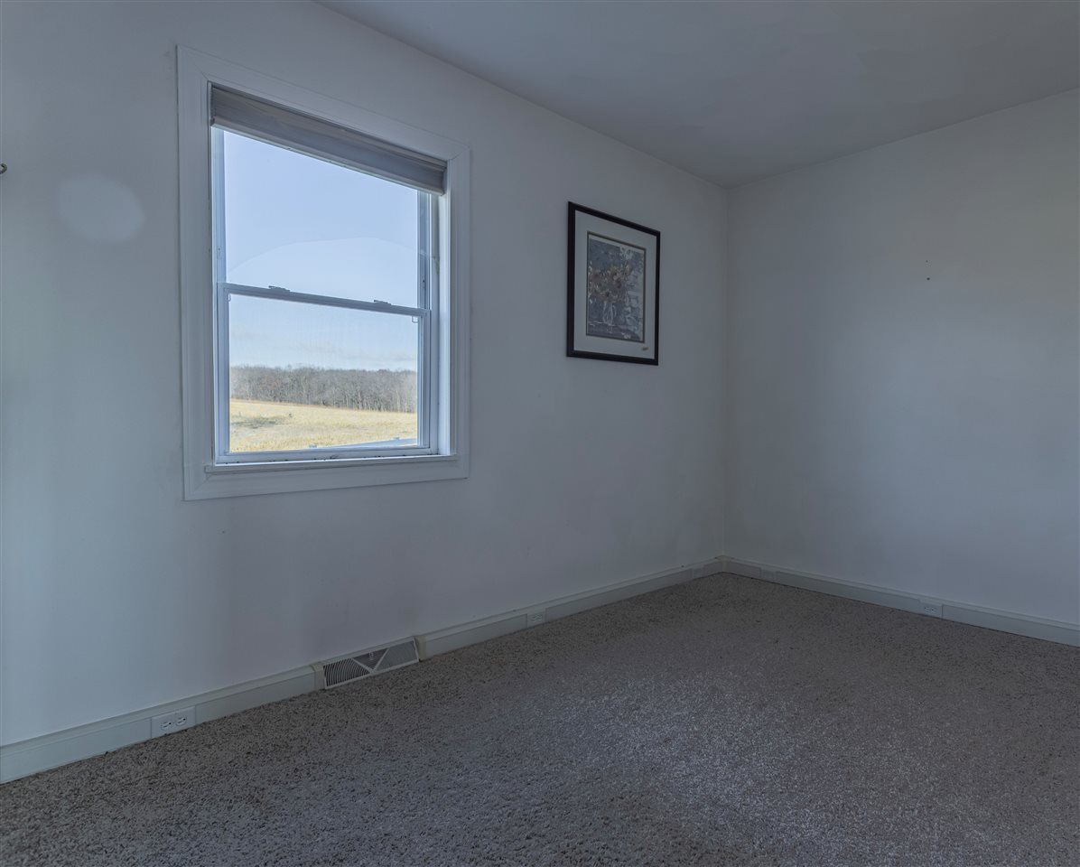 15283 Trask Bridge Road Pecatonica, IL 61063 - Photo 11 of 25 an empty room with a window