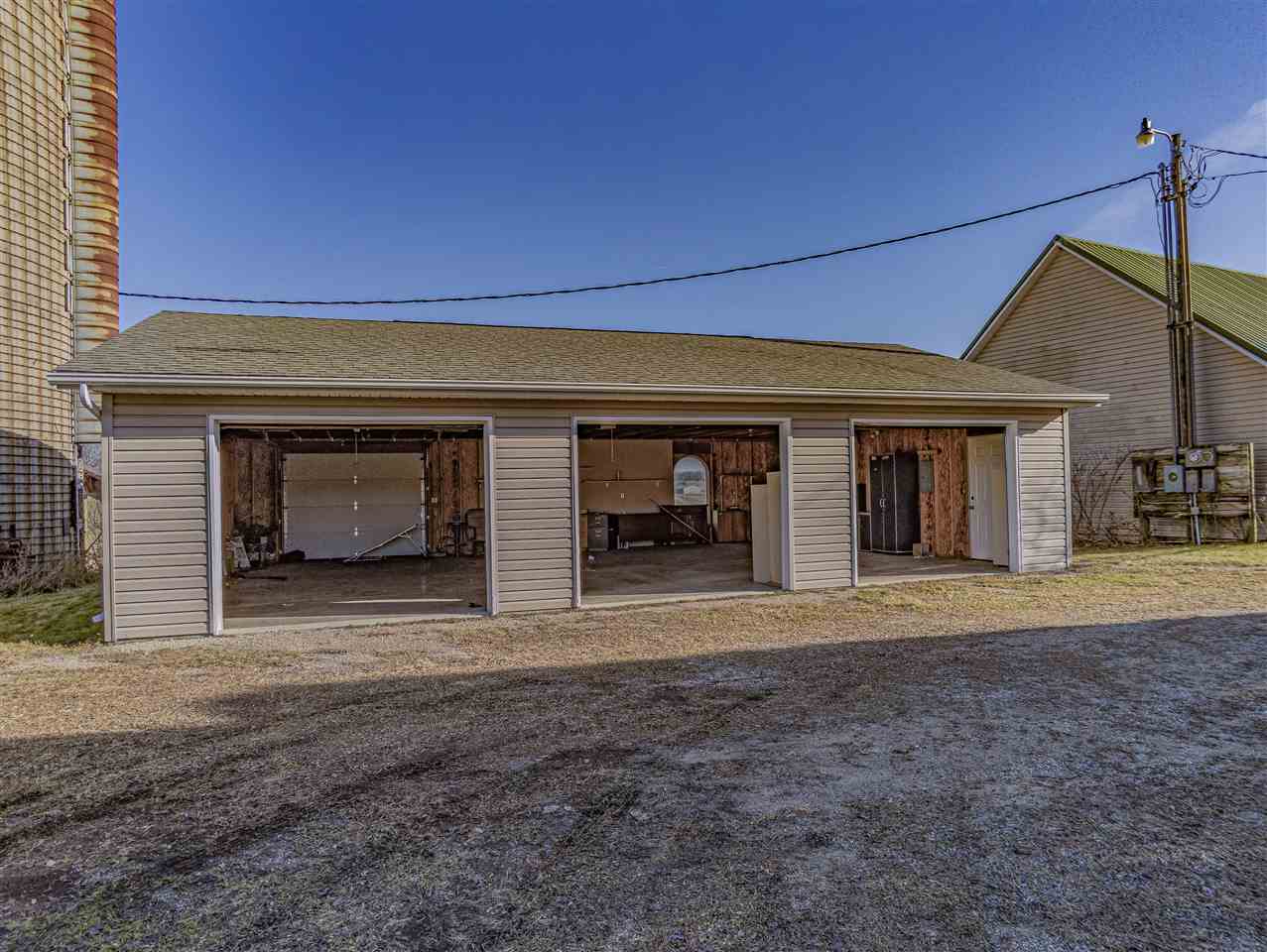 15283 Trask Bridge Road Pecatonica, IL 61063 - Photo 20 of 25 a front view of a house with a yard