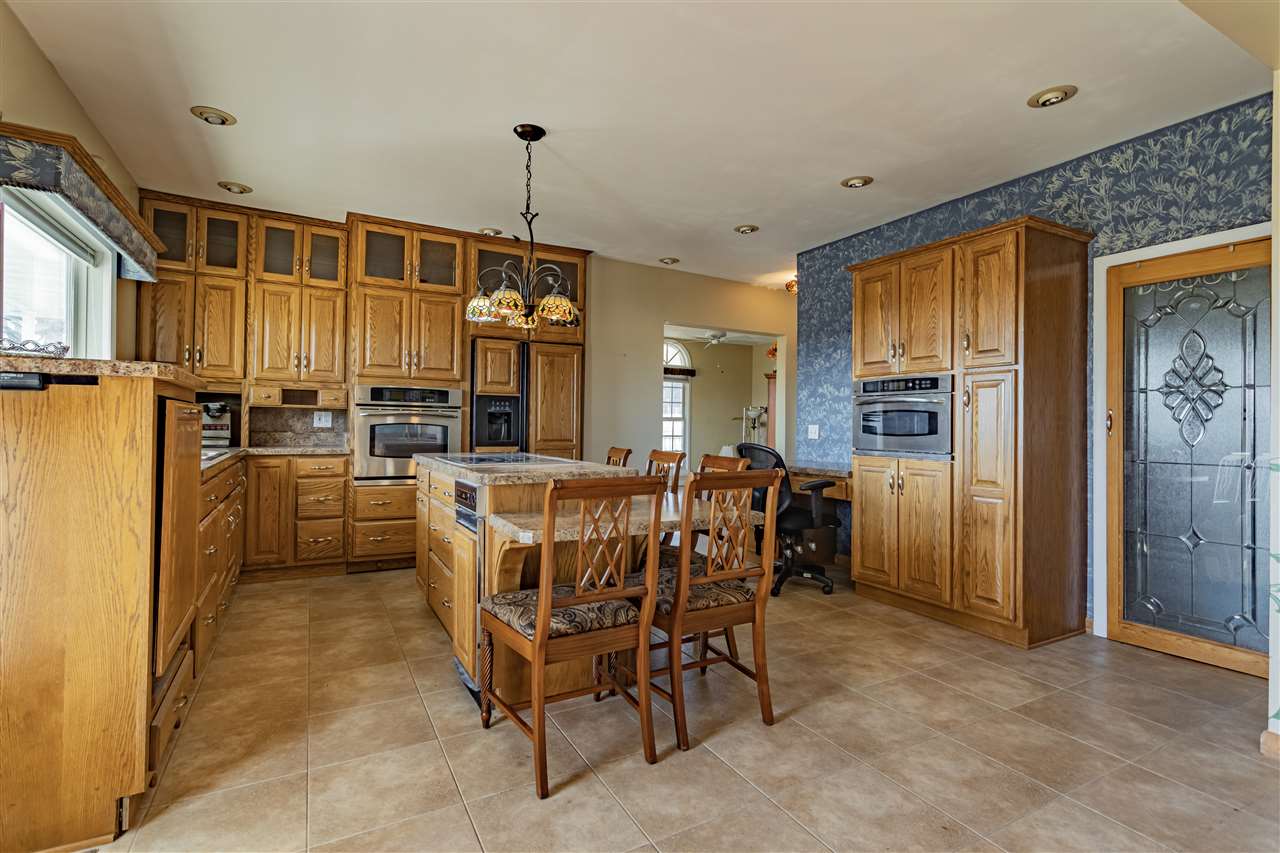 15283 Trask Bridge Road Pecatonica, IL 61063 - Photo 3 of 25 a view of a dining room with furniture