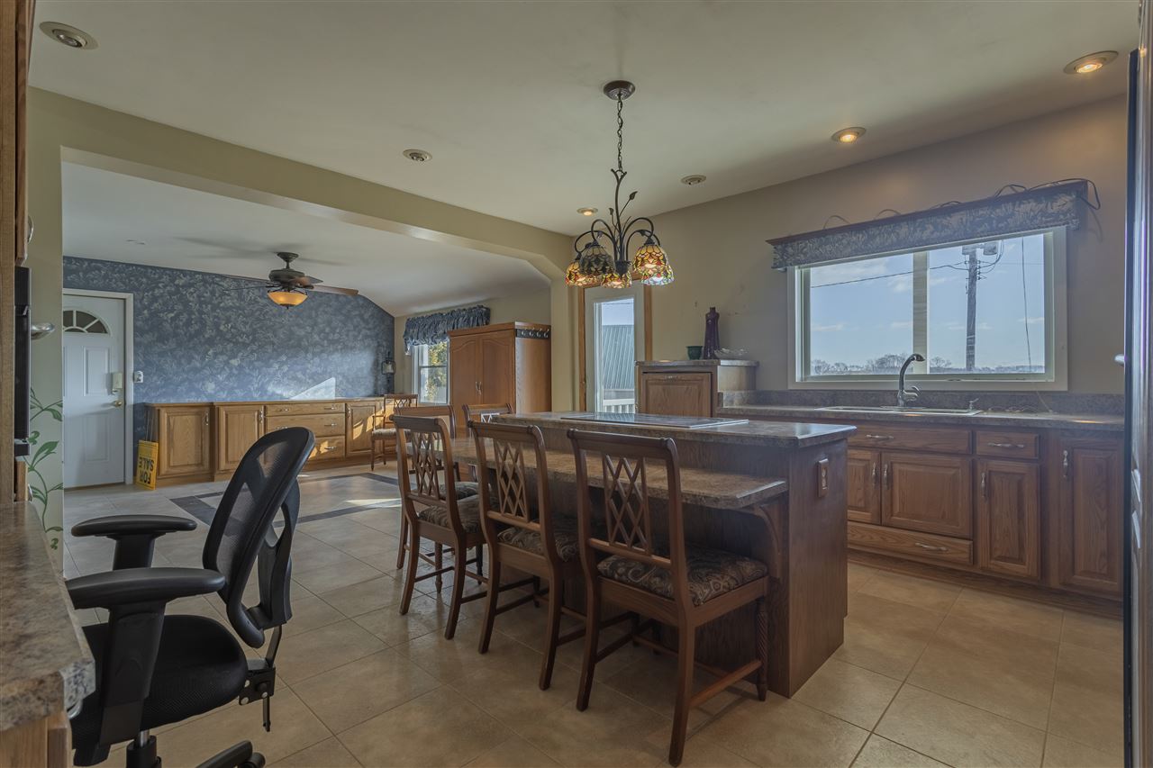 15283 Trask Bridge Road Pecatonica, IL 61063 - Photo 5 of 25 a kitchen with a table and chairs in it